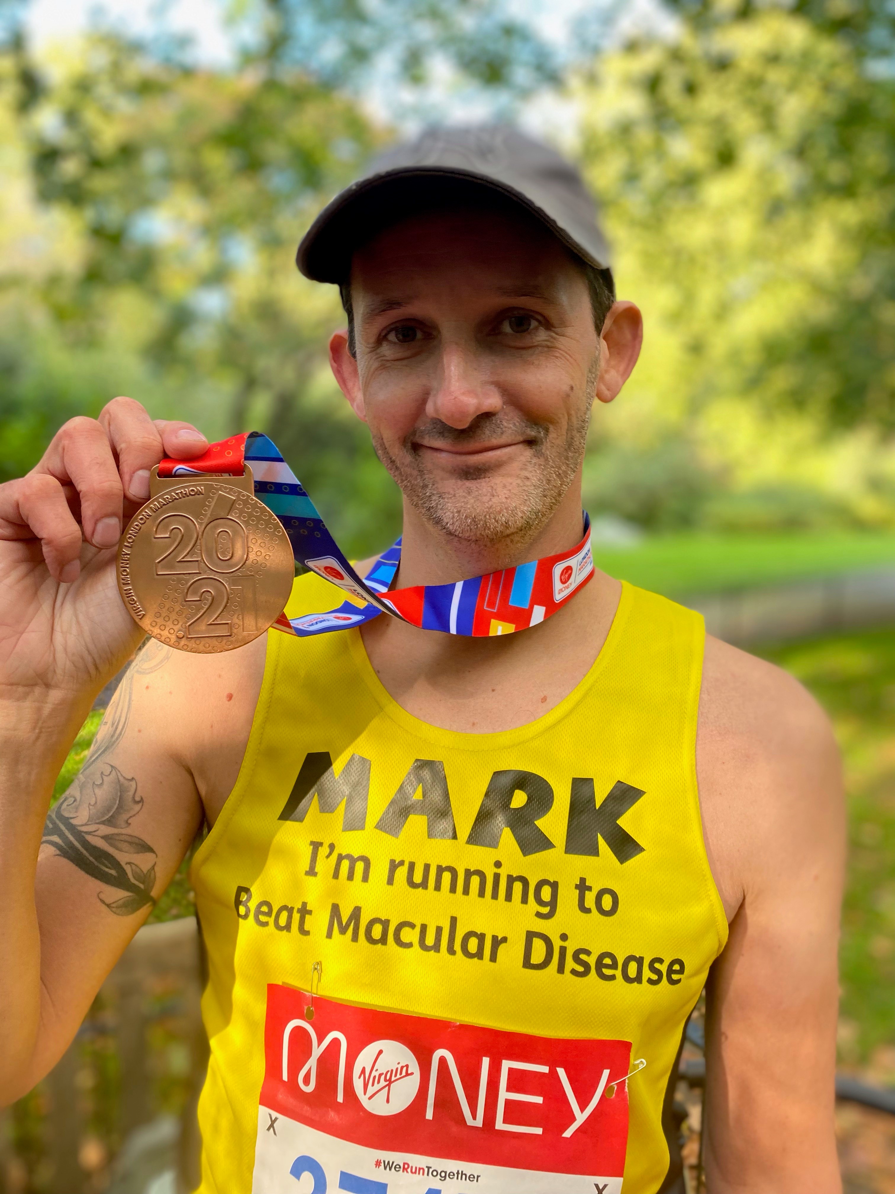 Mark London Marathon with medal 