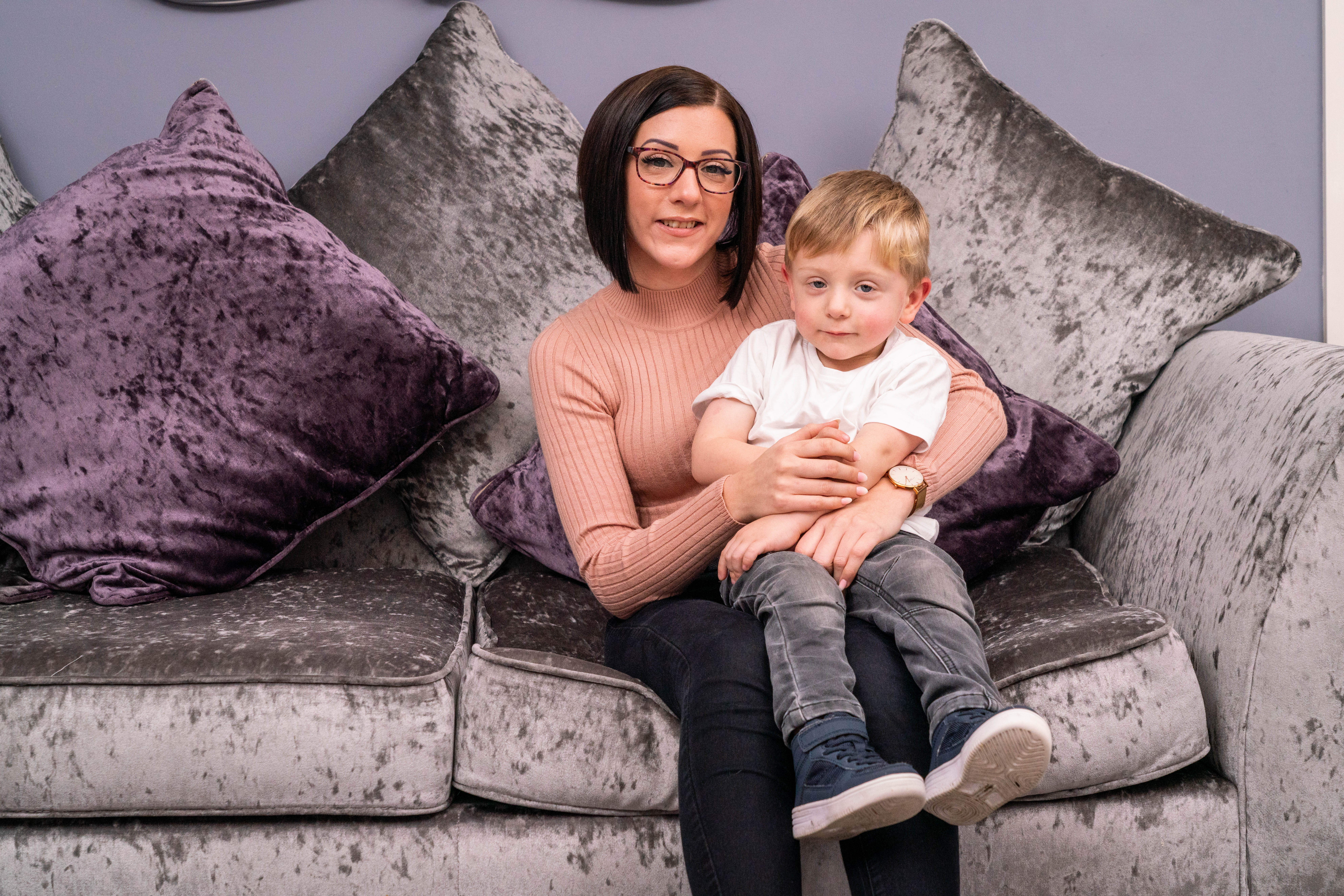 Lisa Alton and son on sofa