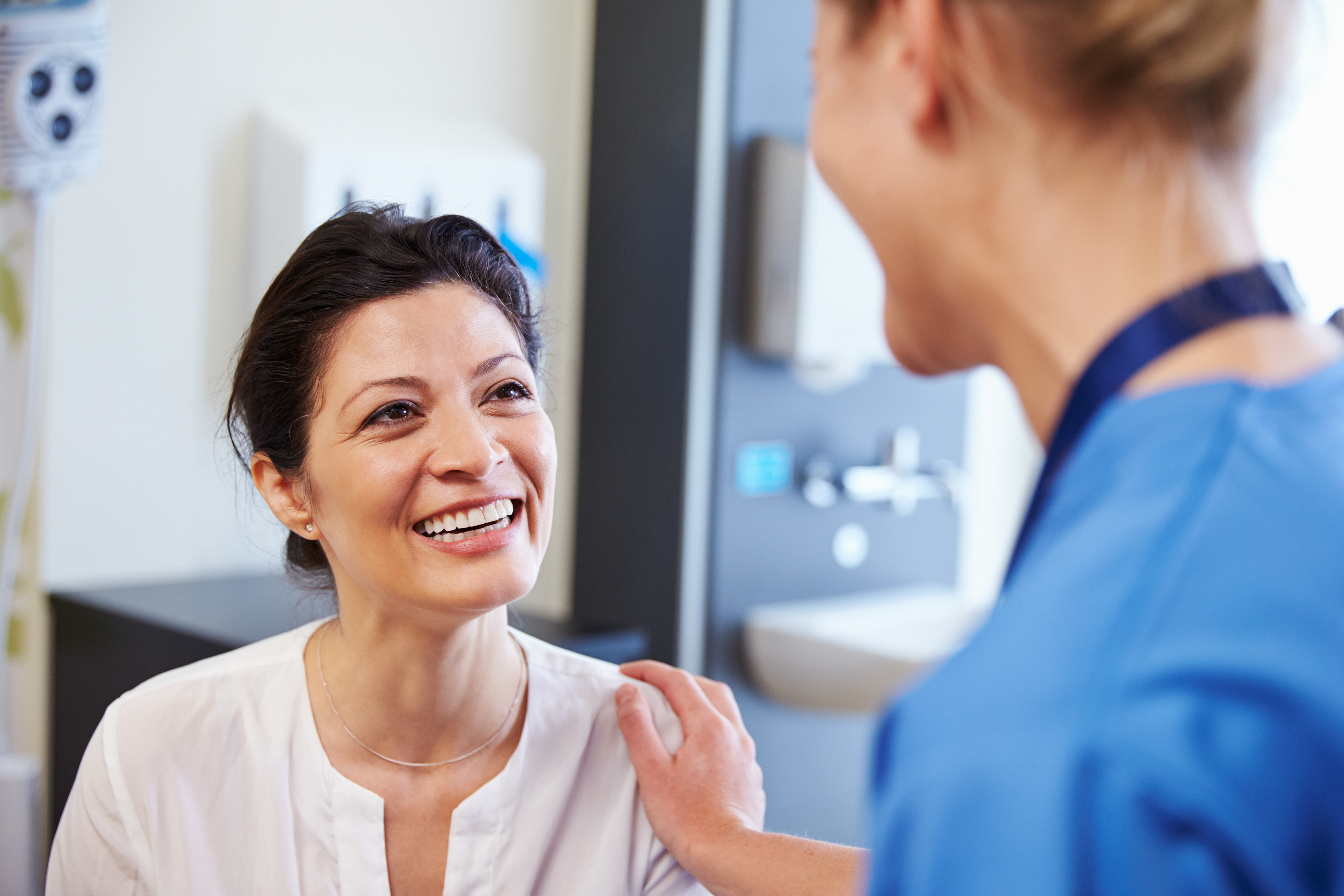 Nurse and patient smiling