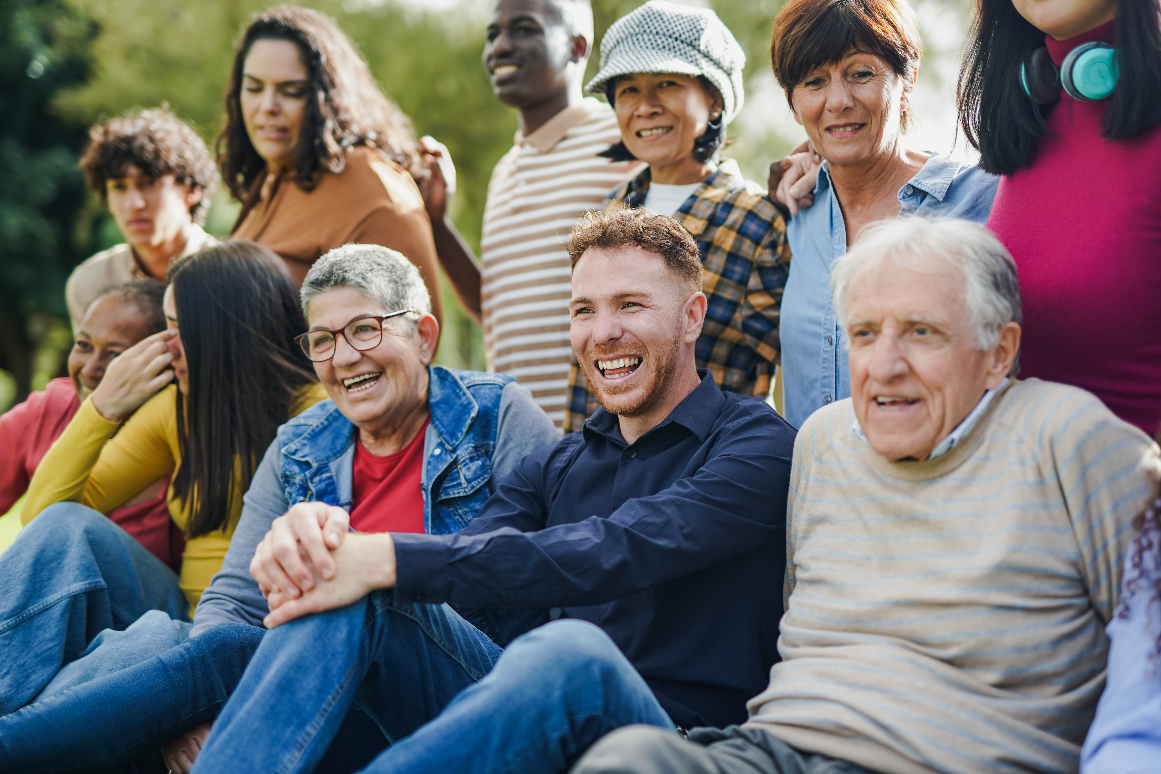 Group of people of mixed ages and races laughing together