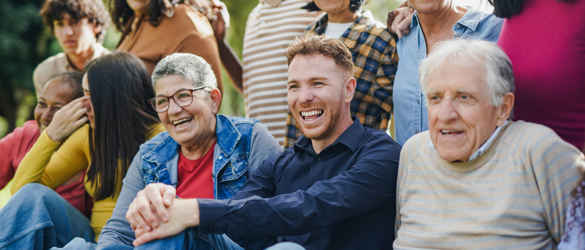 Group of people of mixed ages and races laughing together