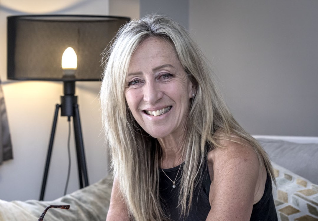 Gill smiling and looking to camera