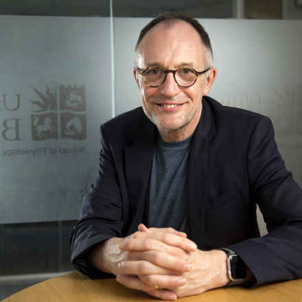 Andrew Dick smiling at camera