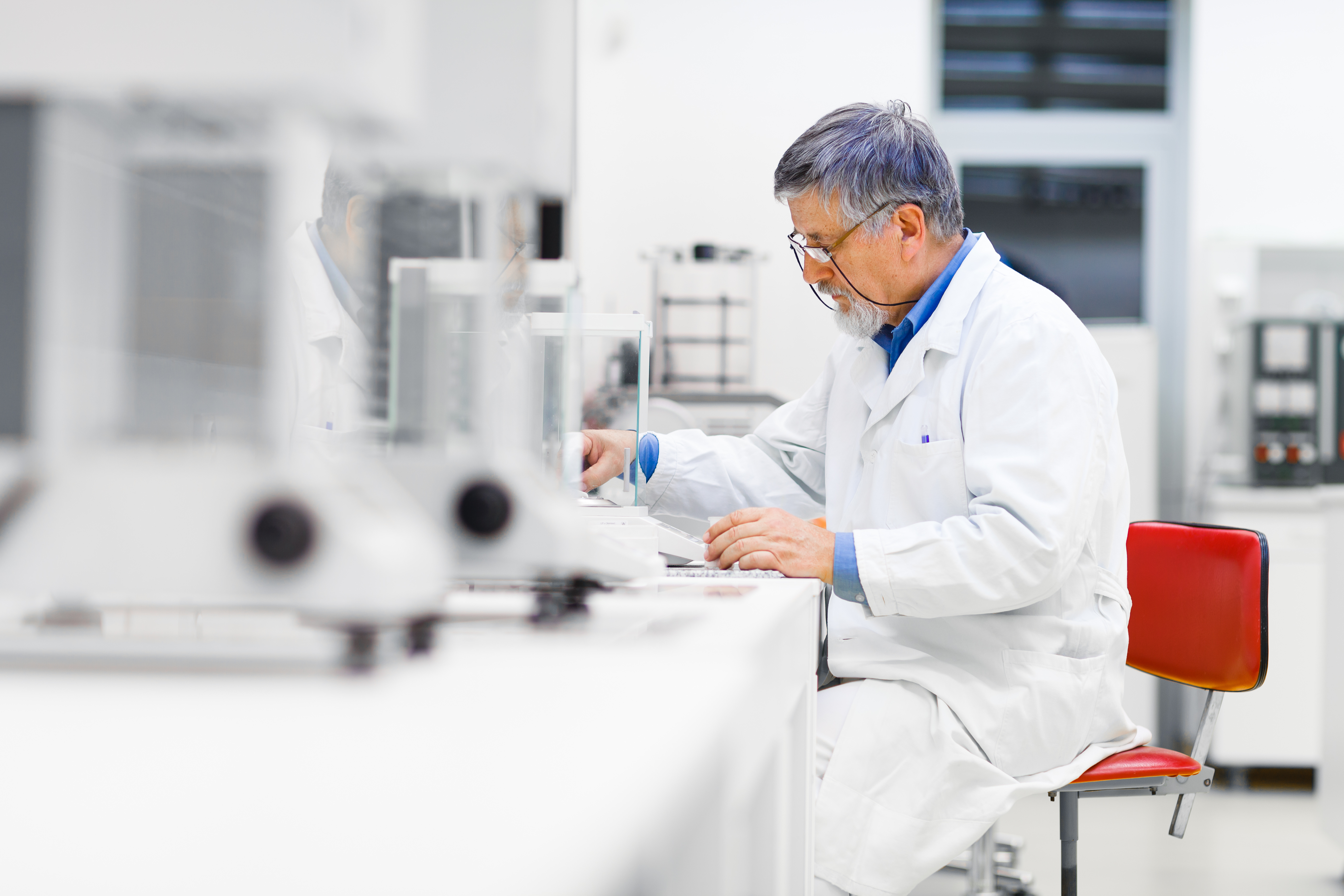 Researcher with various laboratory machines