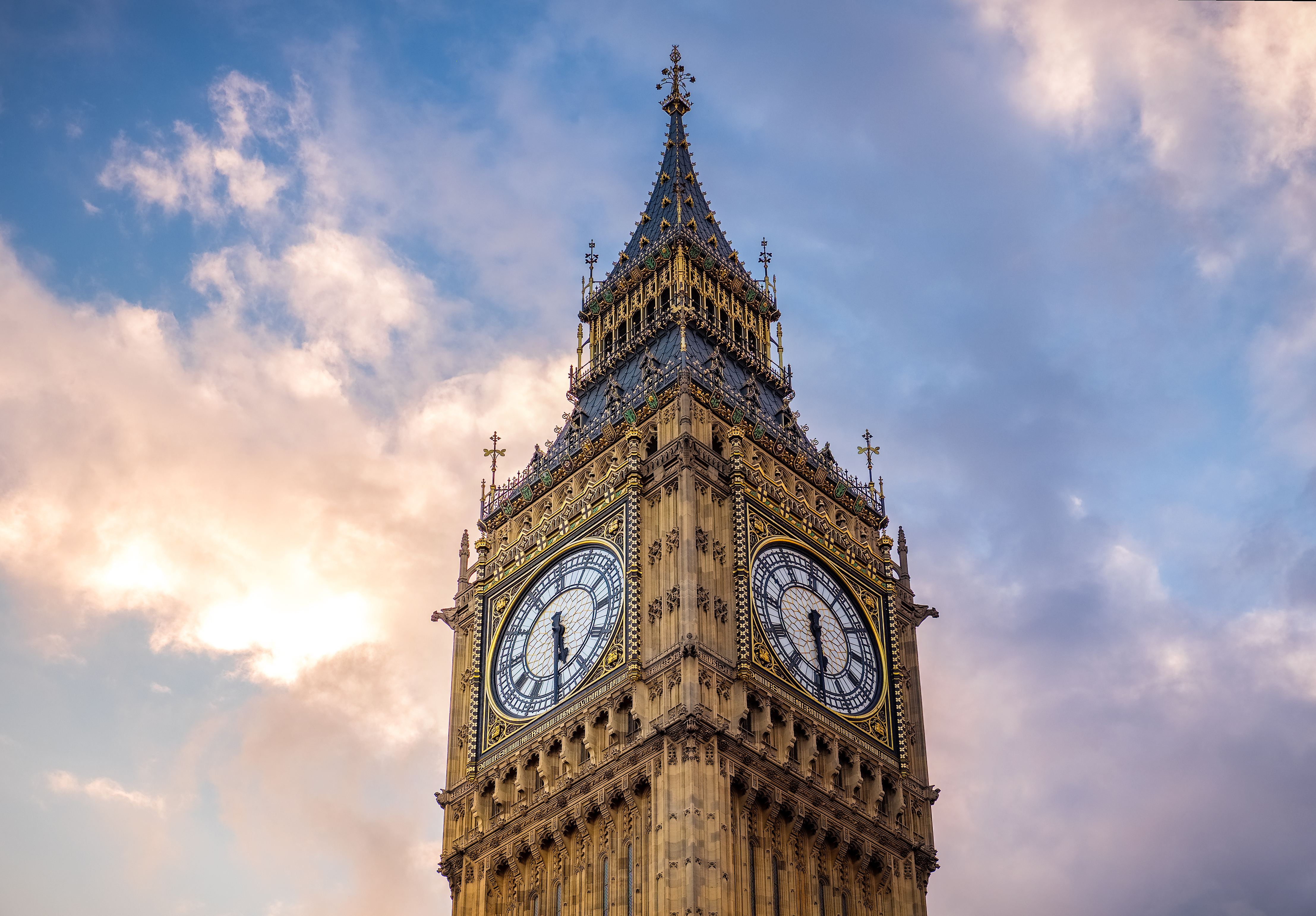 Parliament showing a close up of Big Ben clock tower with a sky background