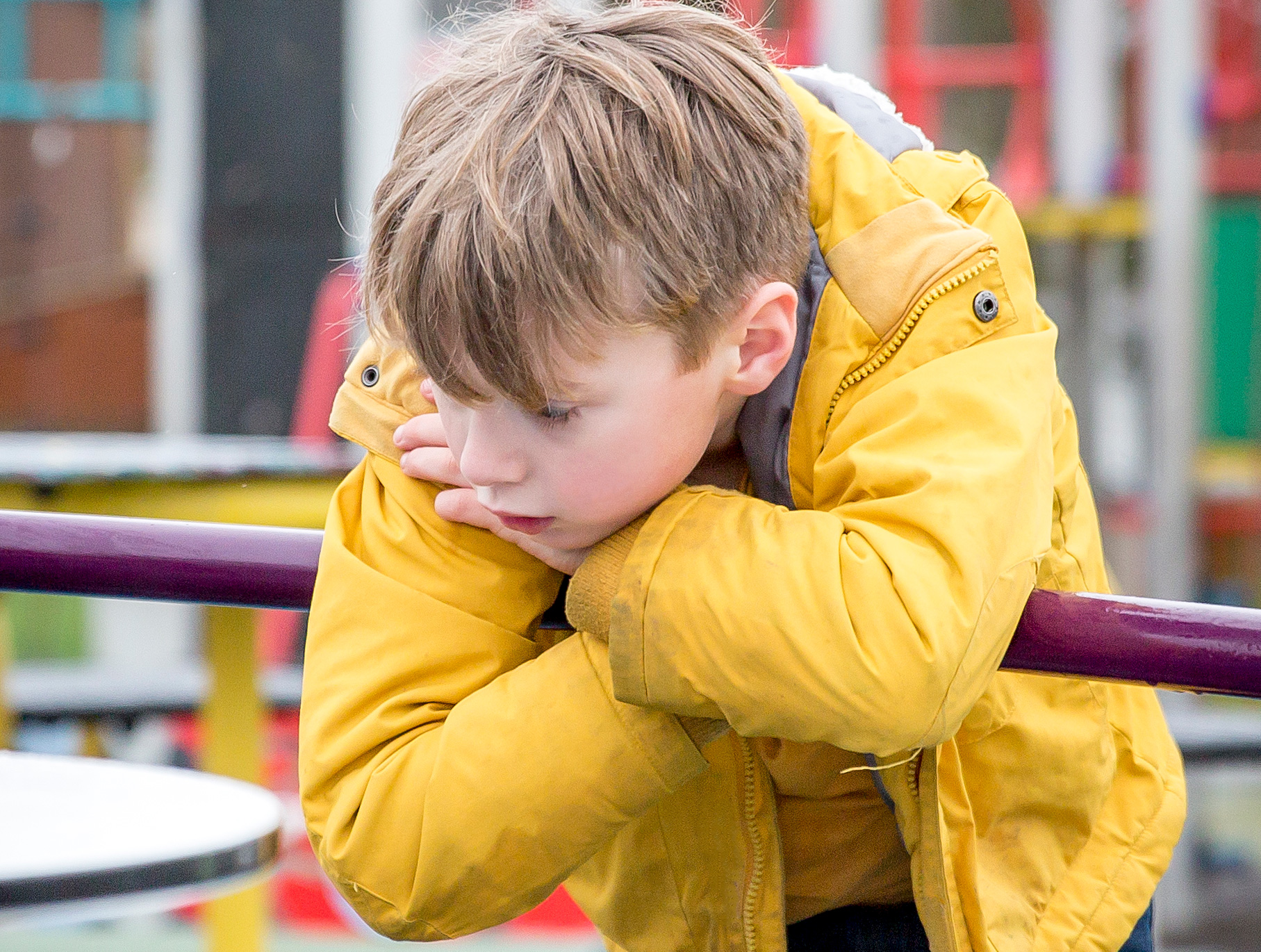 Boy looking sad in Yellow Jacket