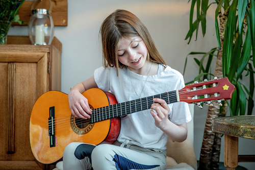 Freya playing the guitar