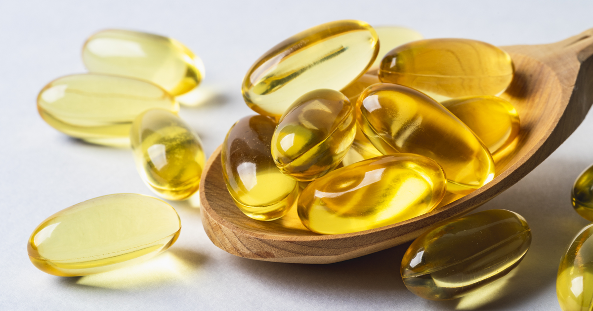 Omega 3 vitamins on spoon 