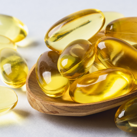 Omega 3 vitamins on spoon 