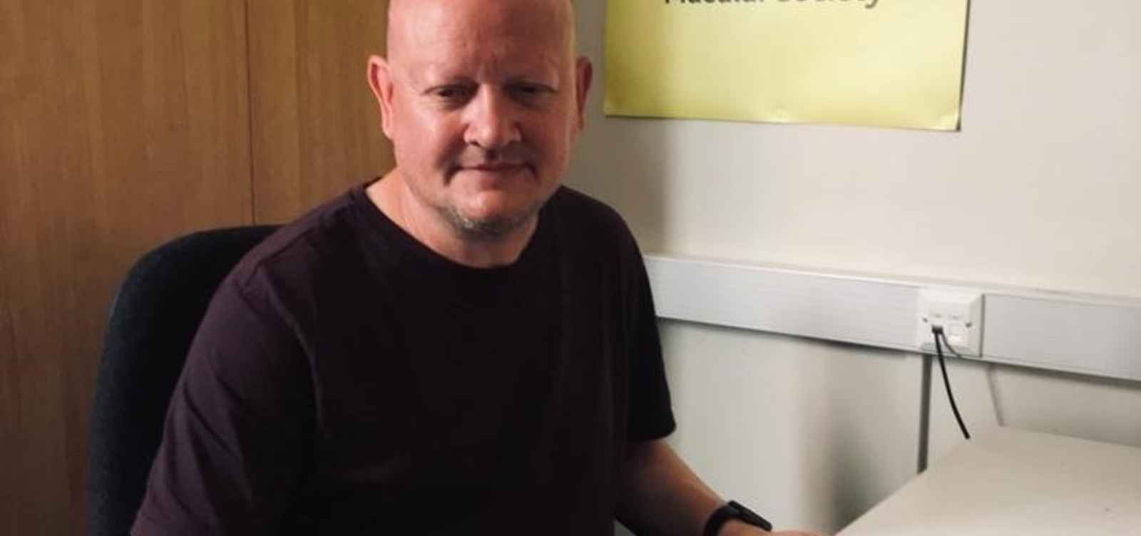 Colin Daniels at desk