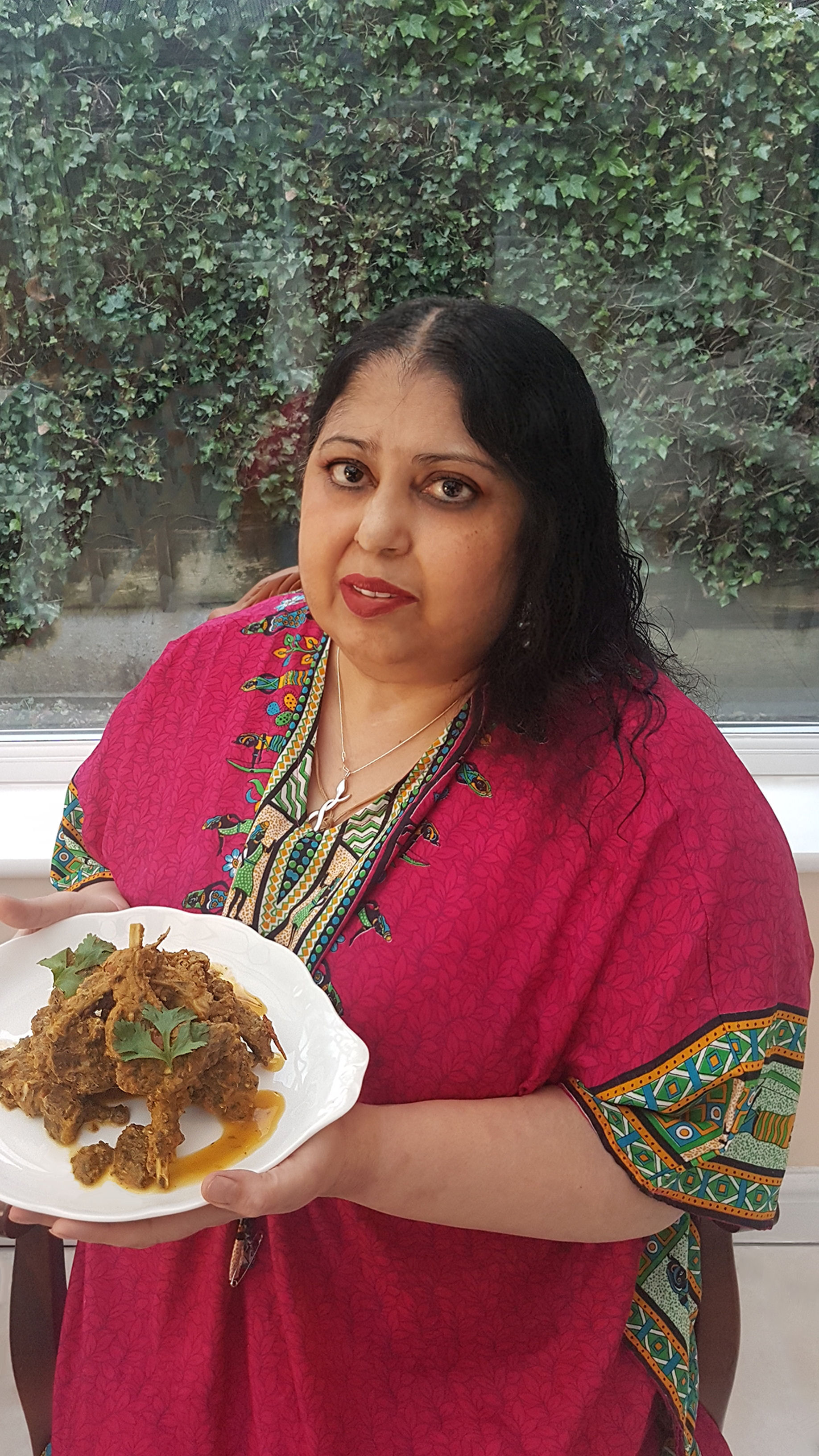 Kim Jaye with a plate of masala chops