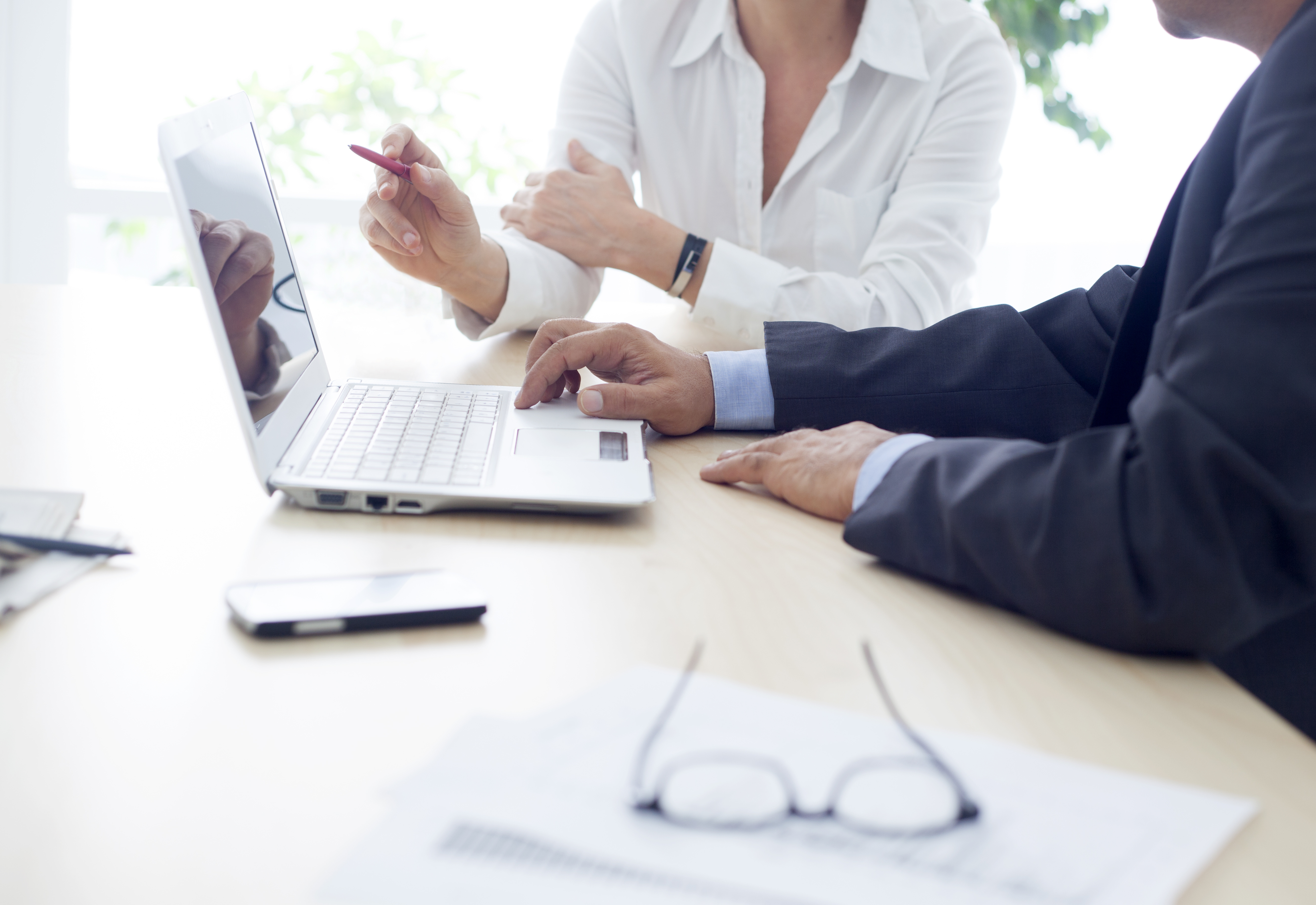 office desk with document and laptop