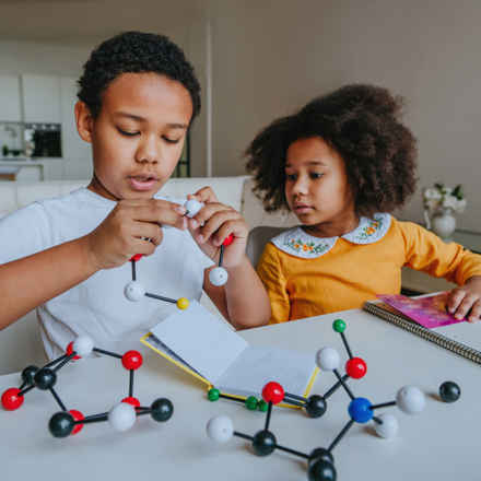 Kids playing with scientific models
