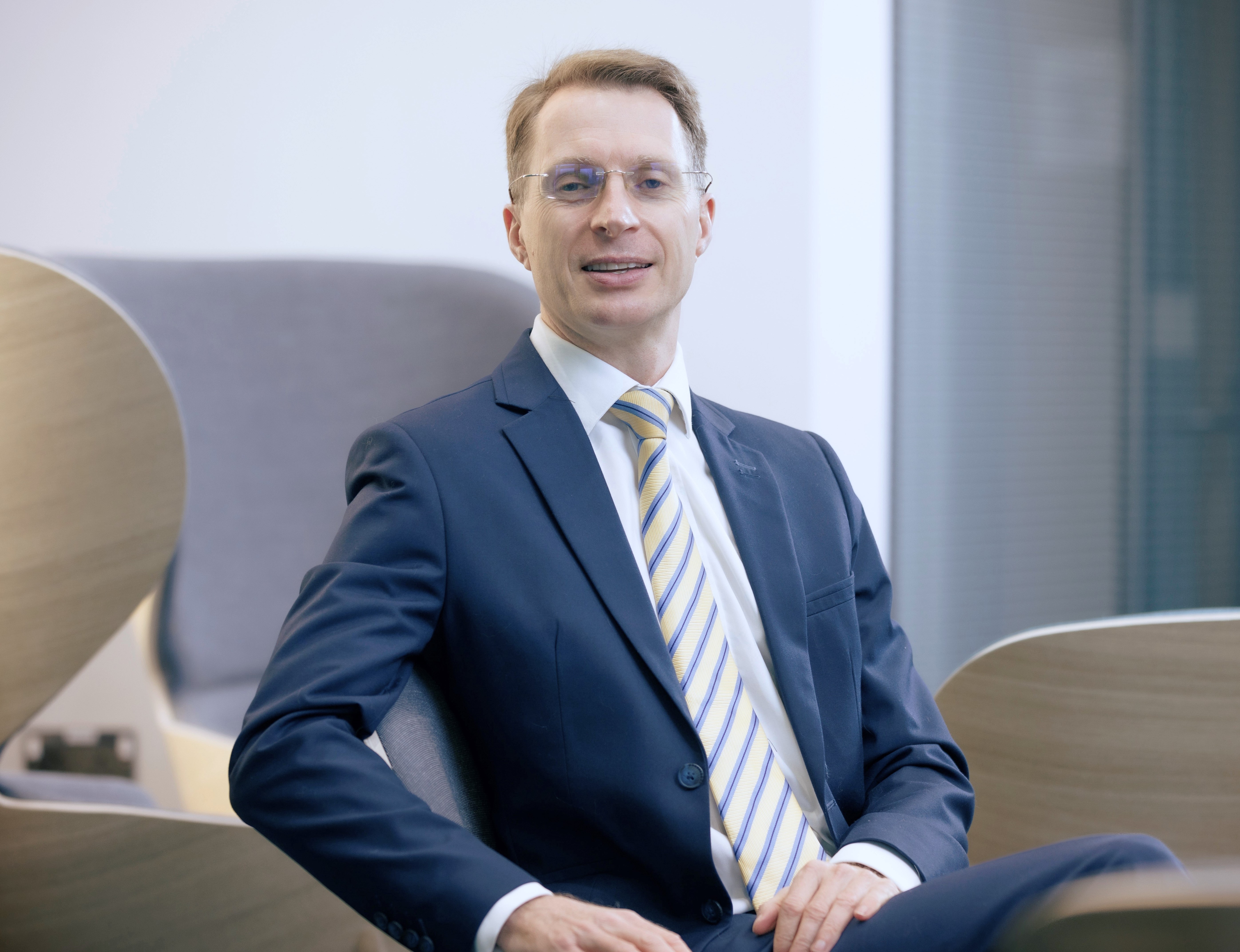 Richard Gale, wearing a suit and glasses