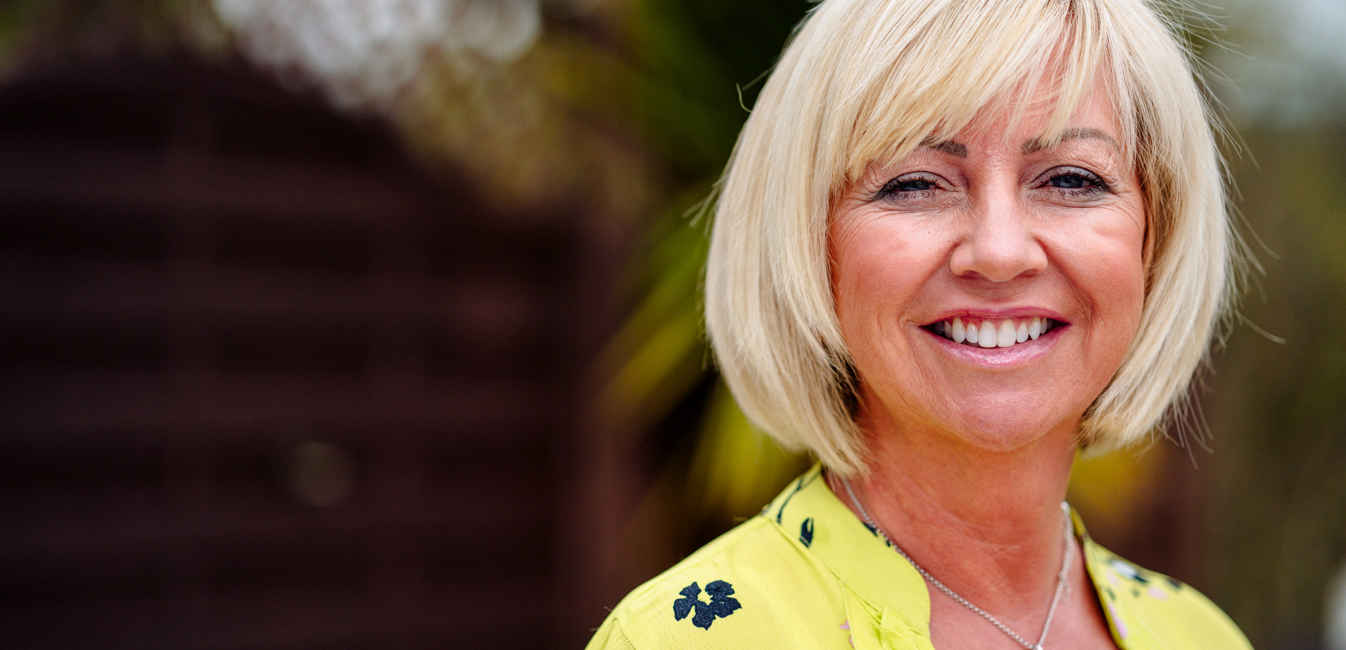 Marcia smiling at camera