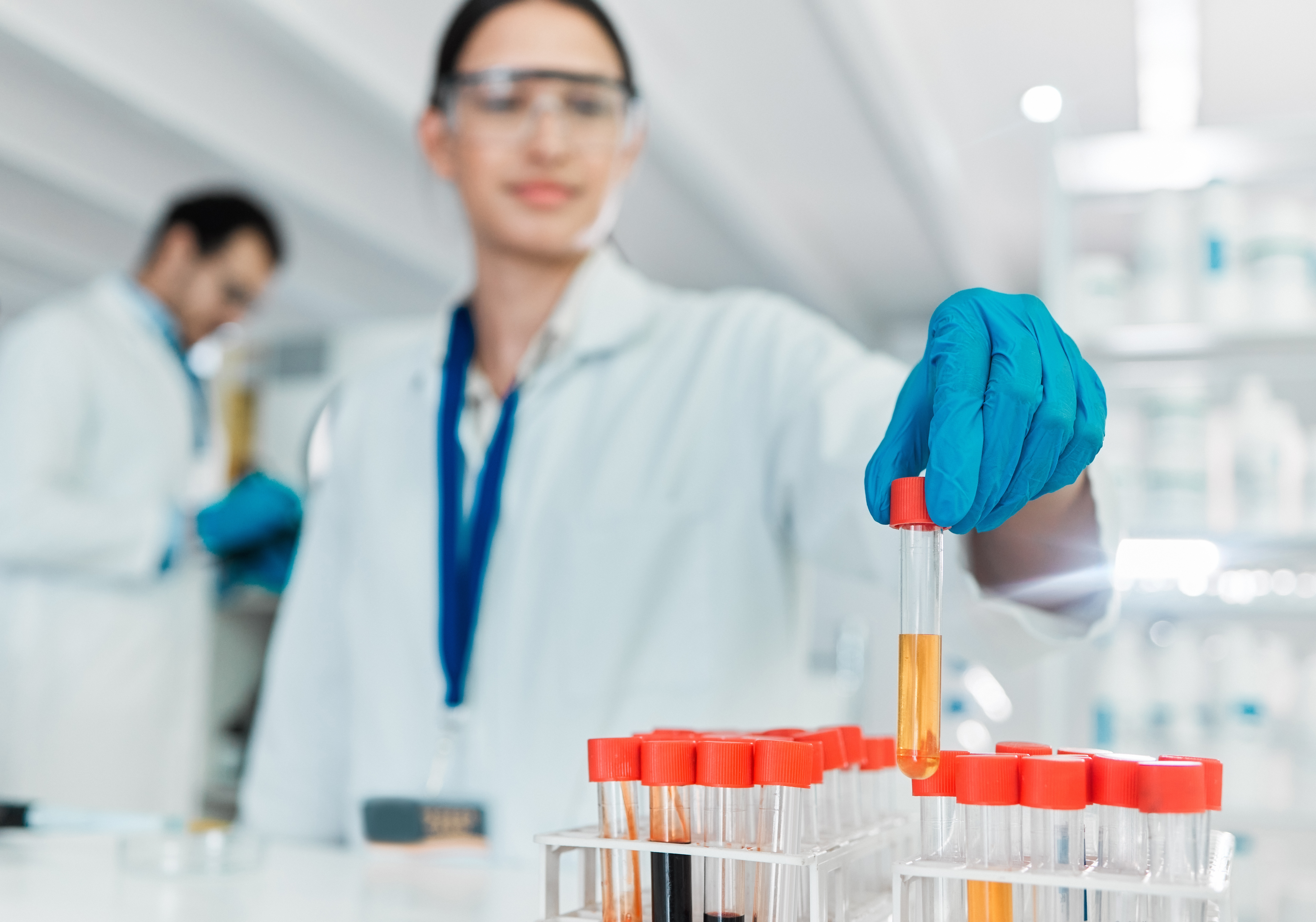 Researcher In Laboratory Holding Test Tubes