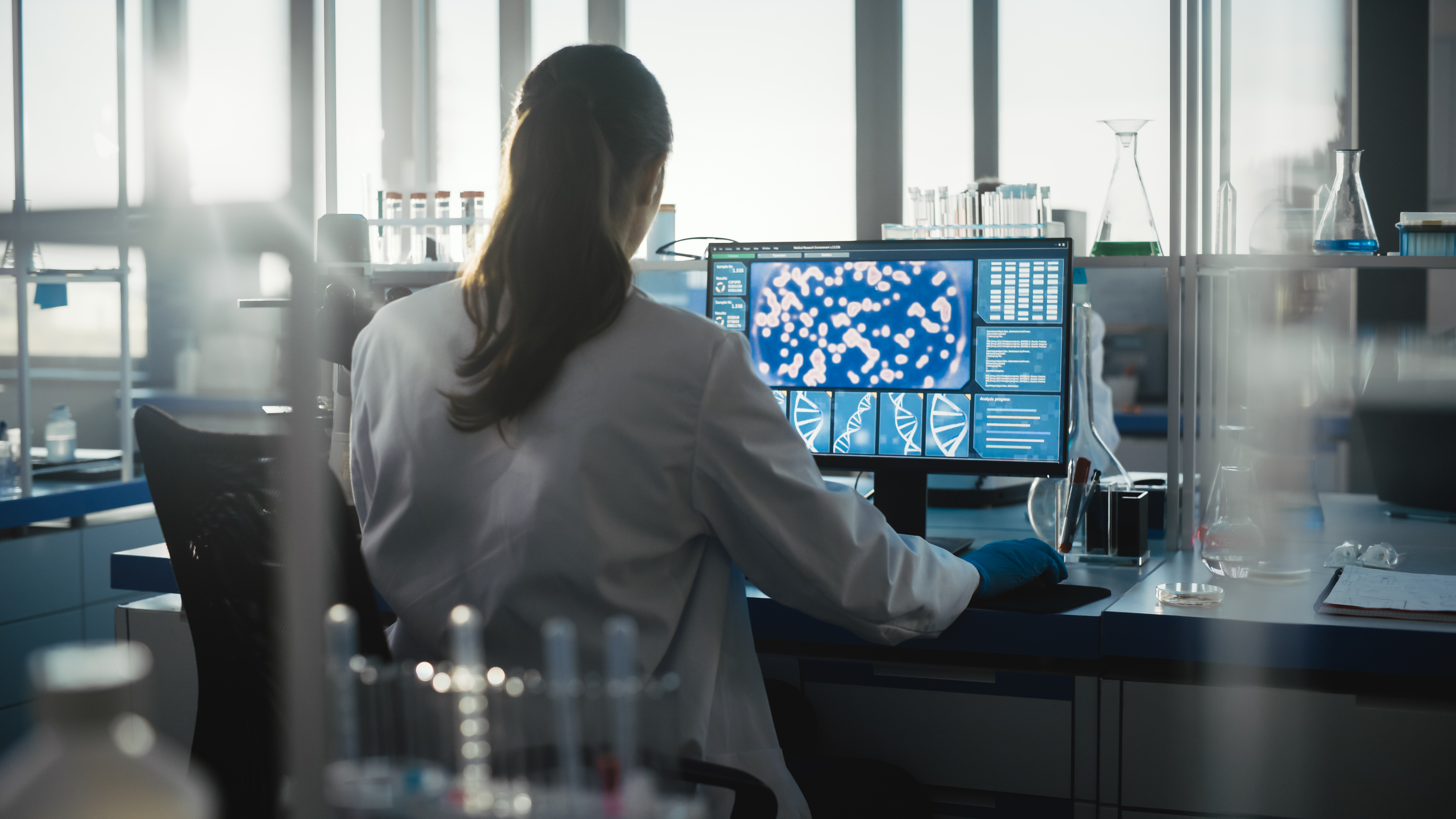 Woman on computer in a lab 