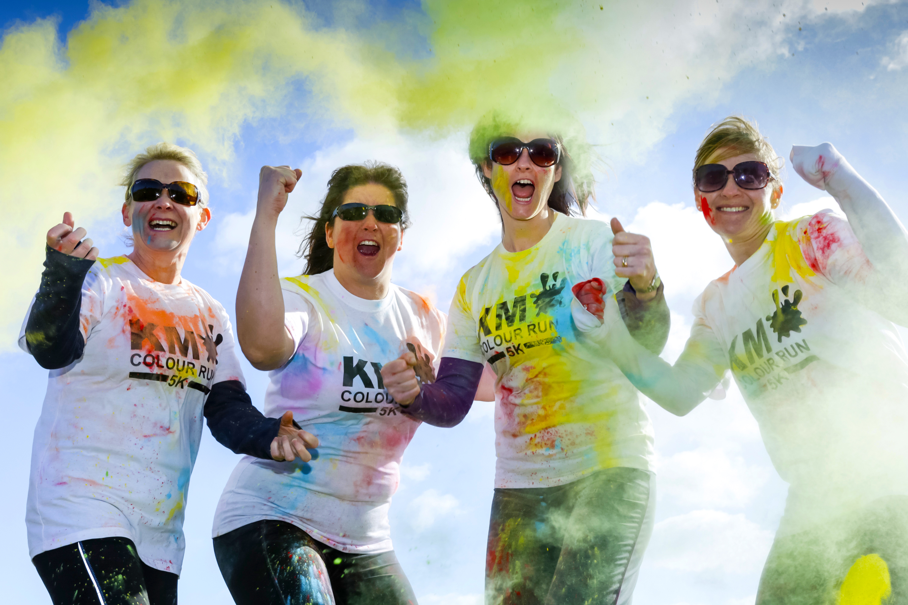 Colour run, four women covered in colourful powders