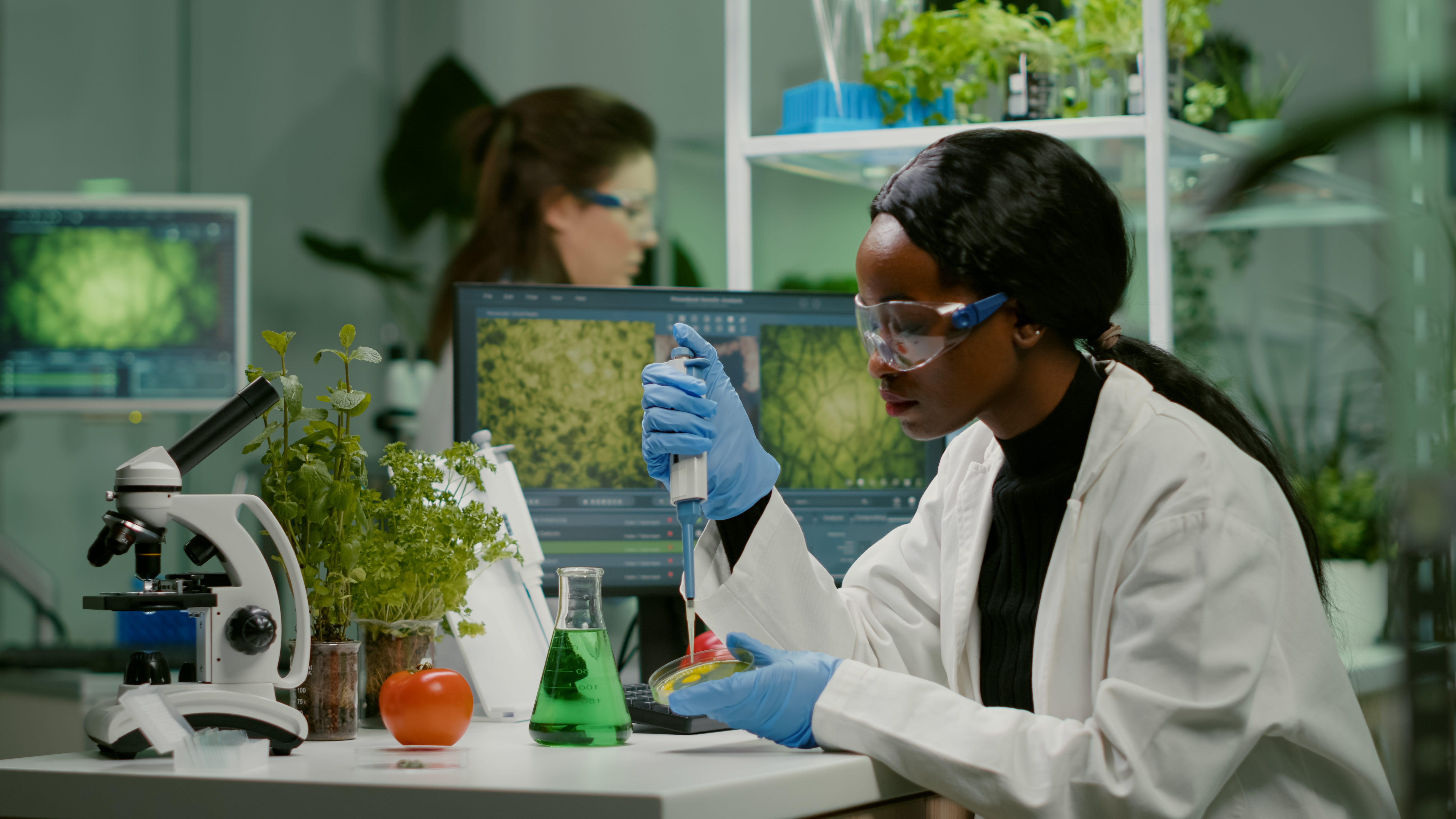scientist researching surrounded by plants