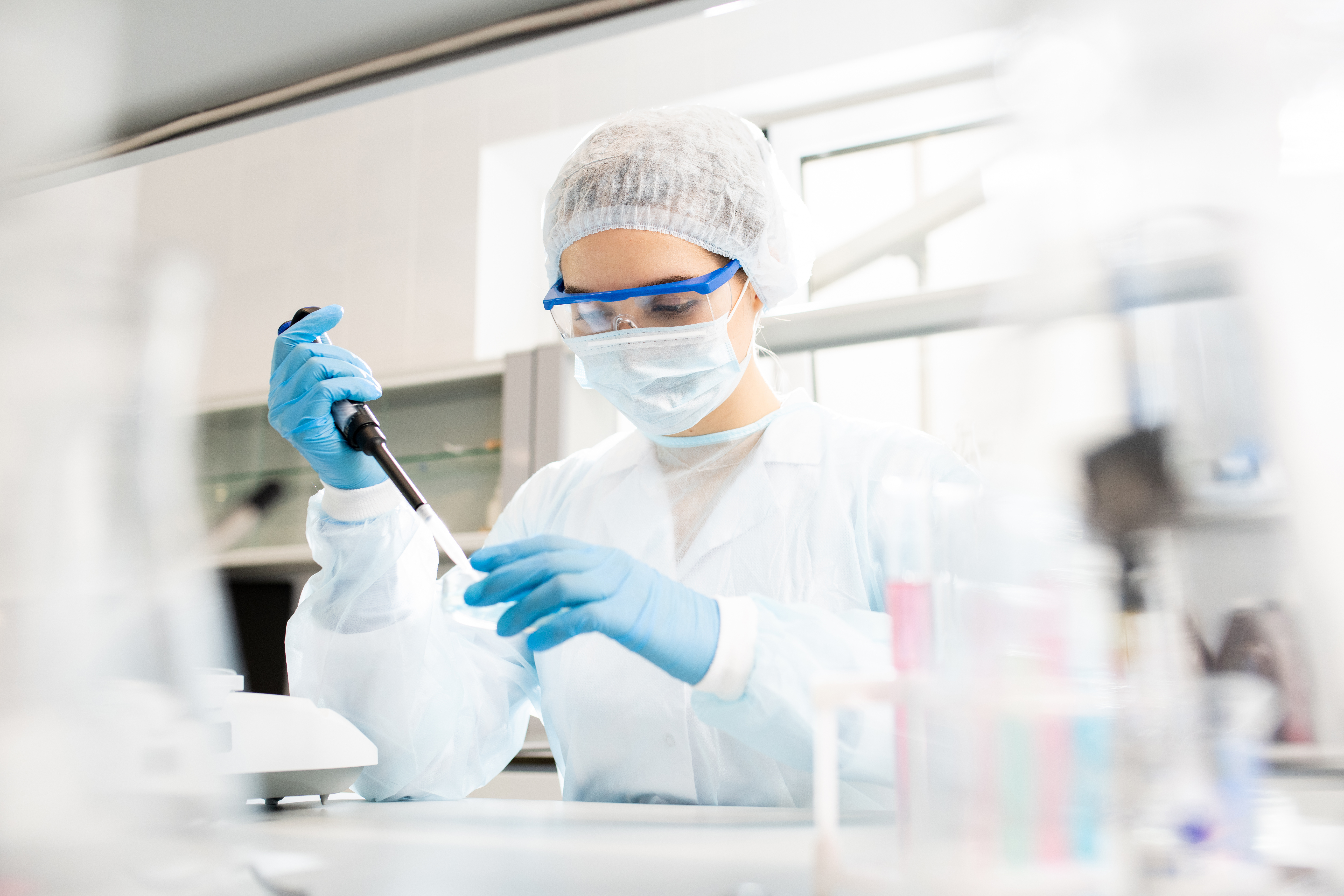 micro biologist with petri dish