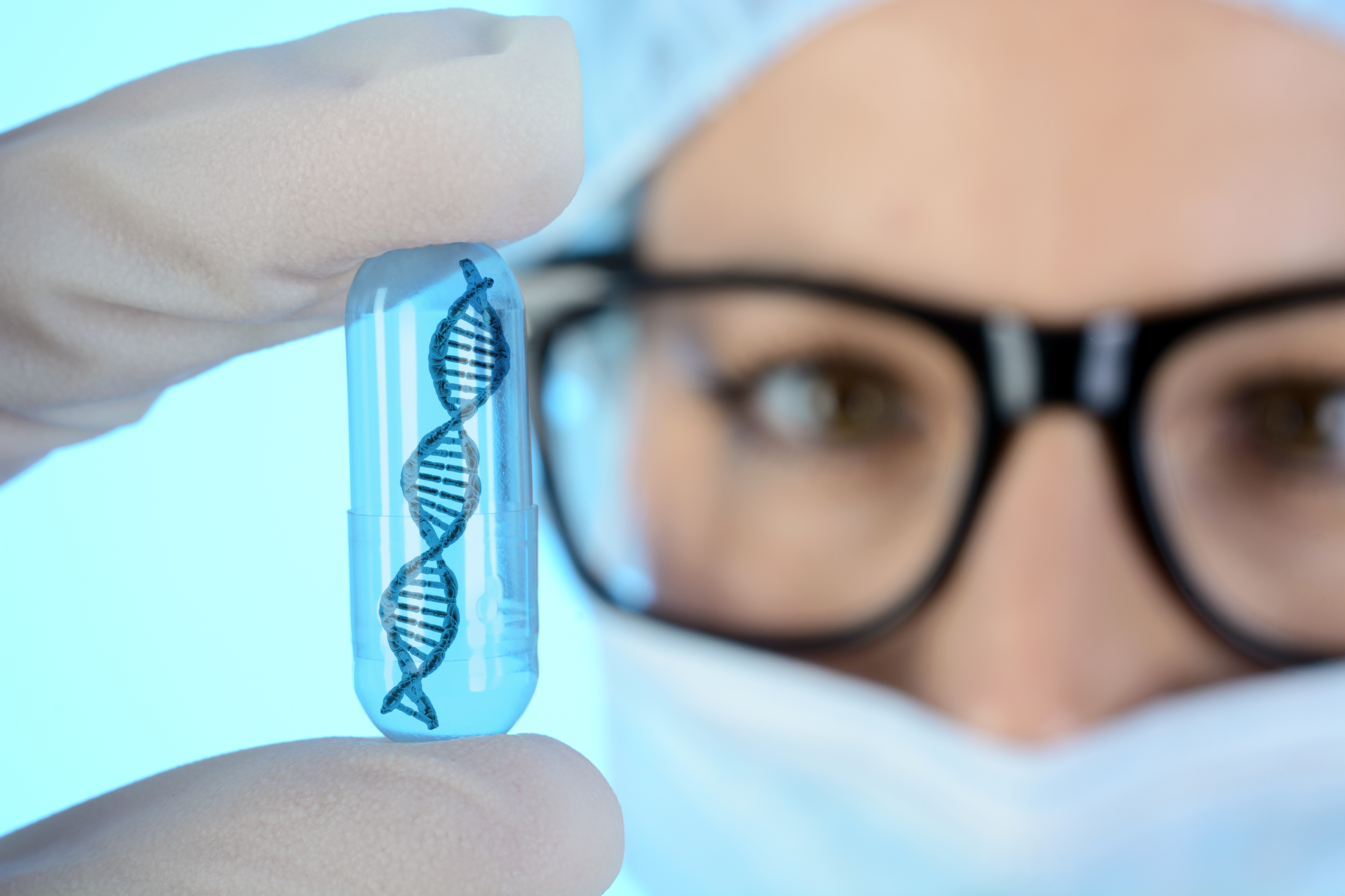 DNA Research, scientist holds up double helix