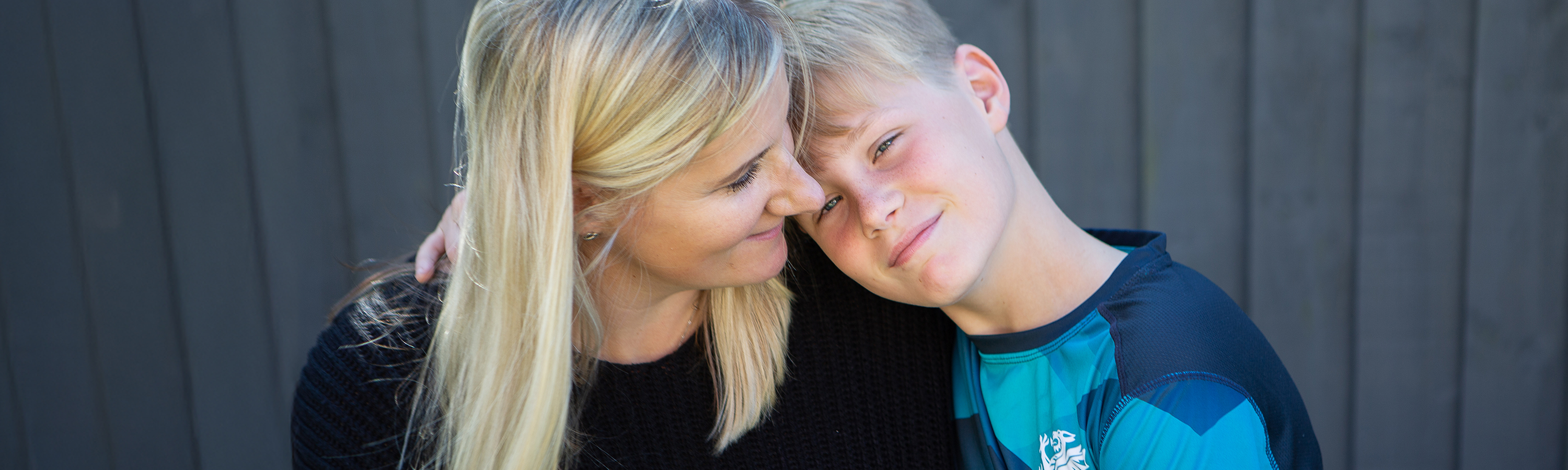 Sian posing closely with and smiling at her son Archie