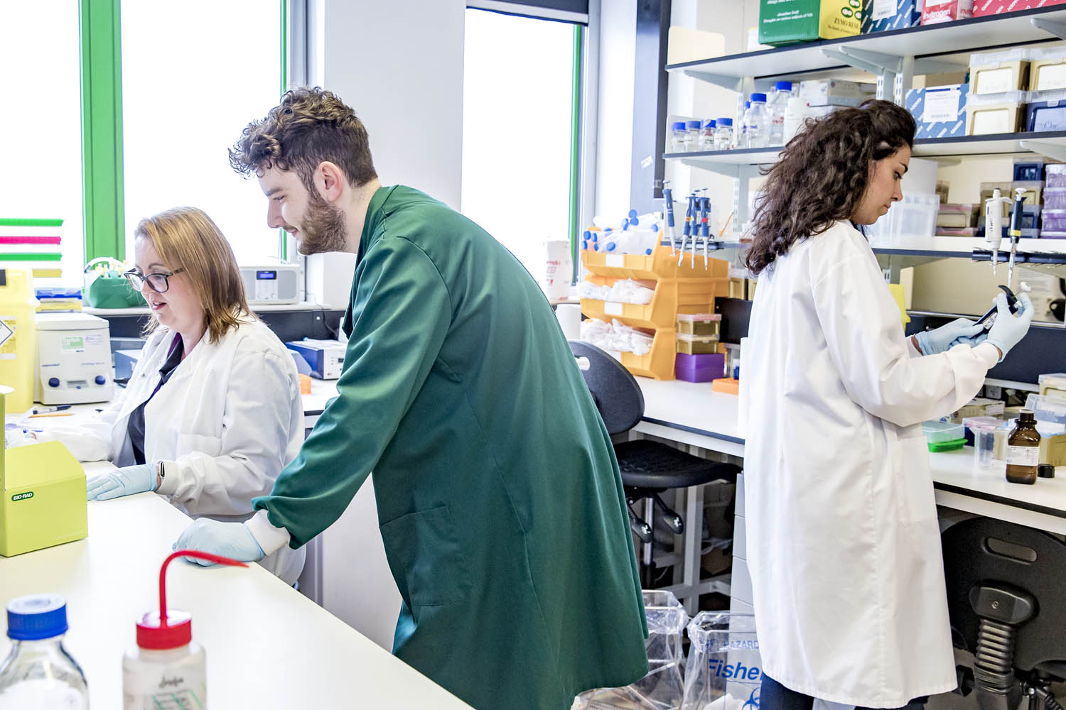 Three Researchers Lab Man in Green Coat