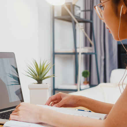 Annual conference, woman on laptop