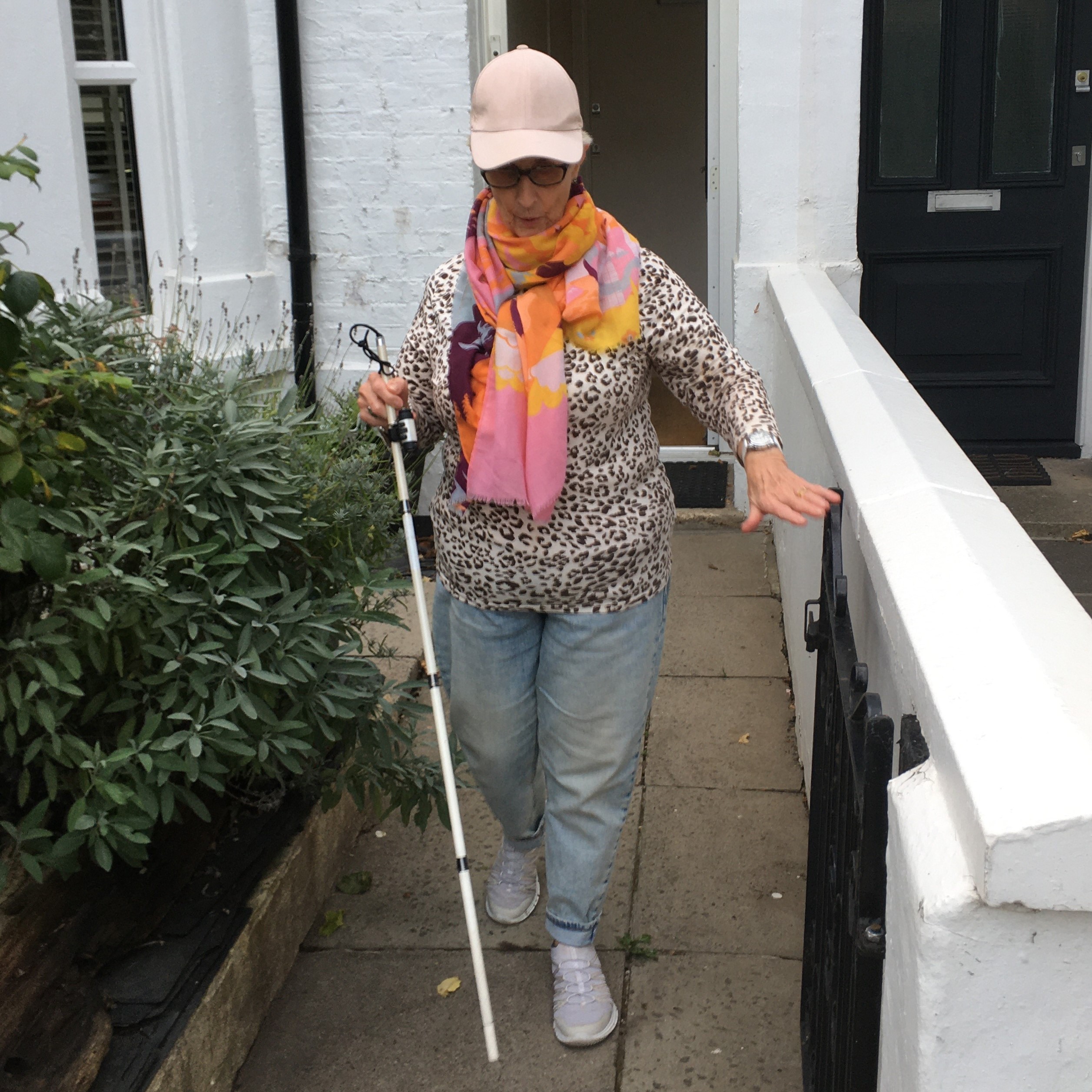 Irene walking outside with stick