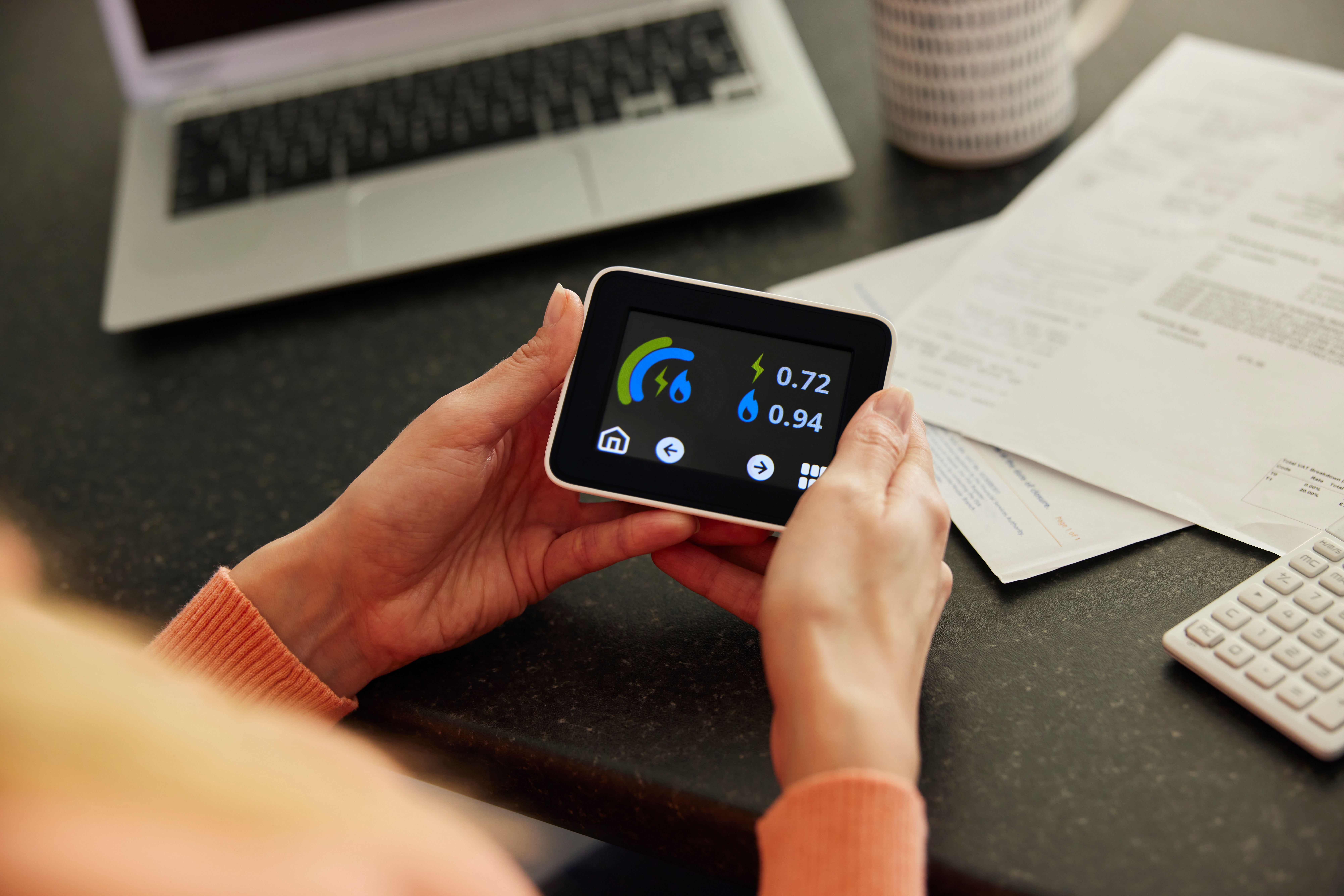 Woman holding energy reader