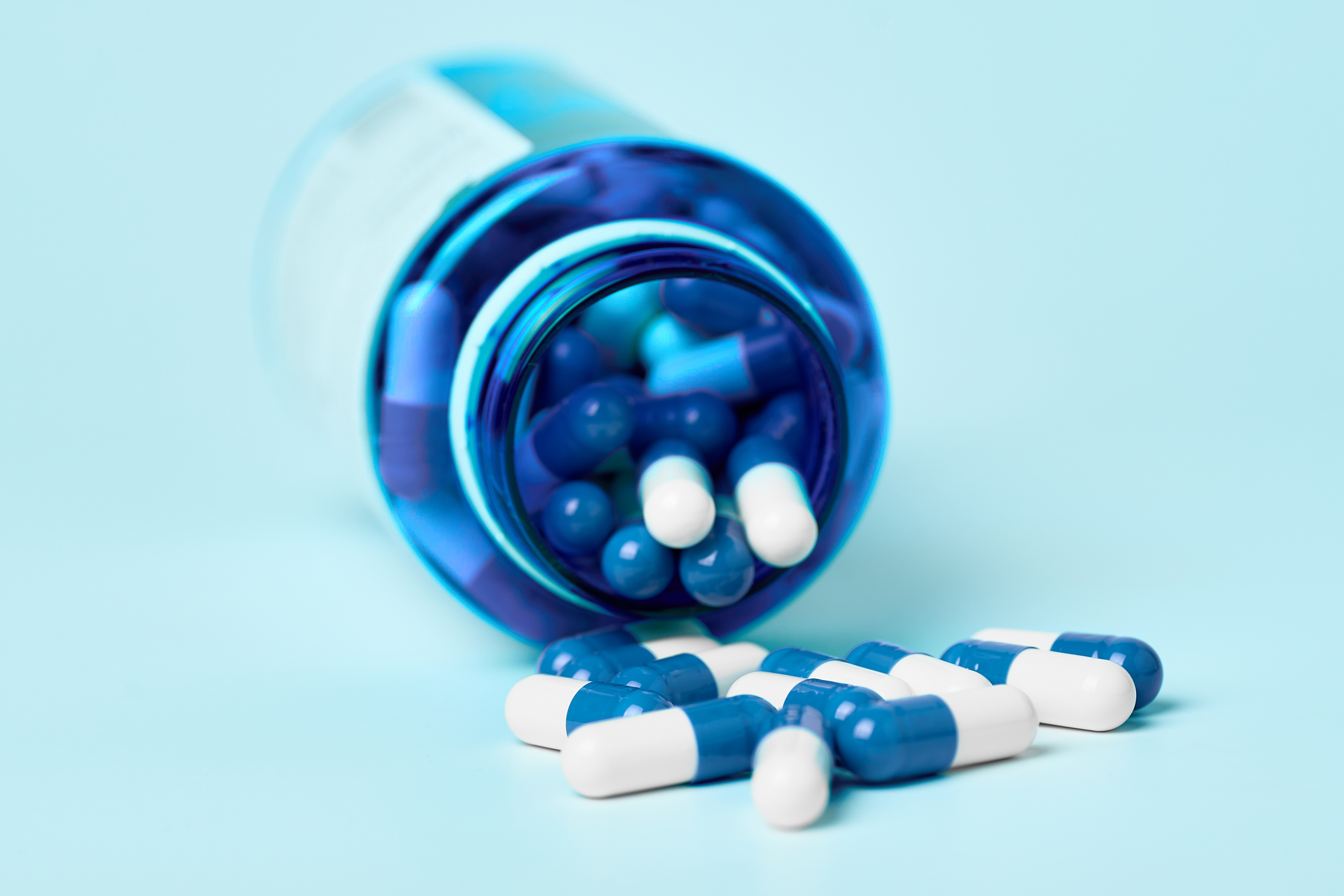 Pills spilling from a bottle