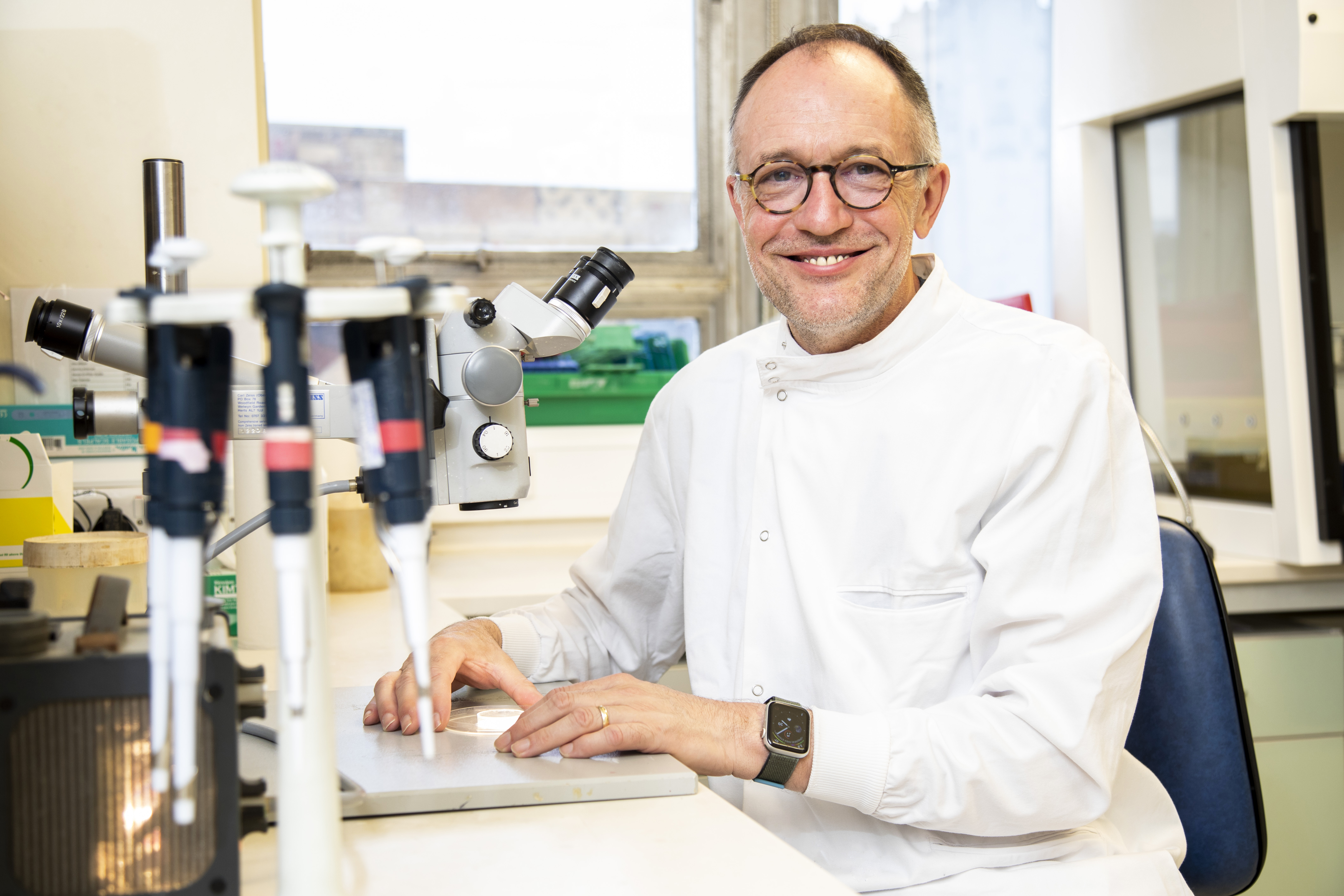 Andrew Dick in laboratory smiling at camera