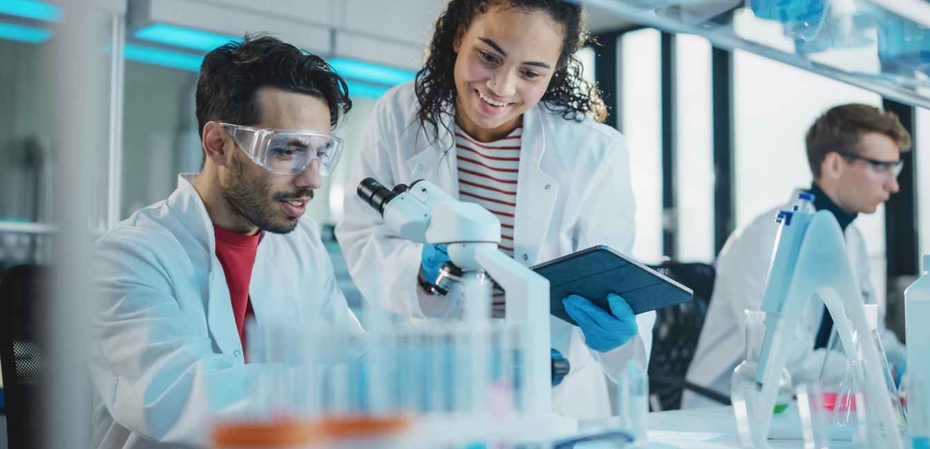 Research image of three technicians in a laboratory 