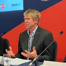 Staff member speaking at a conference