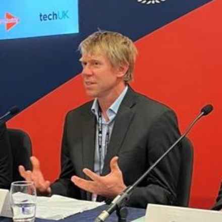 Staff member speaking at a conference