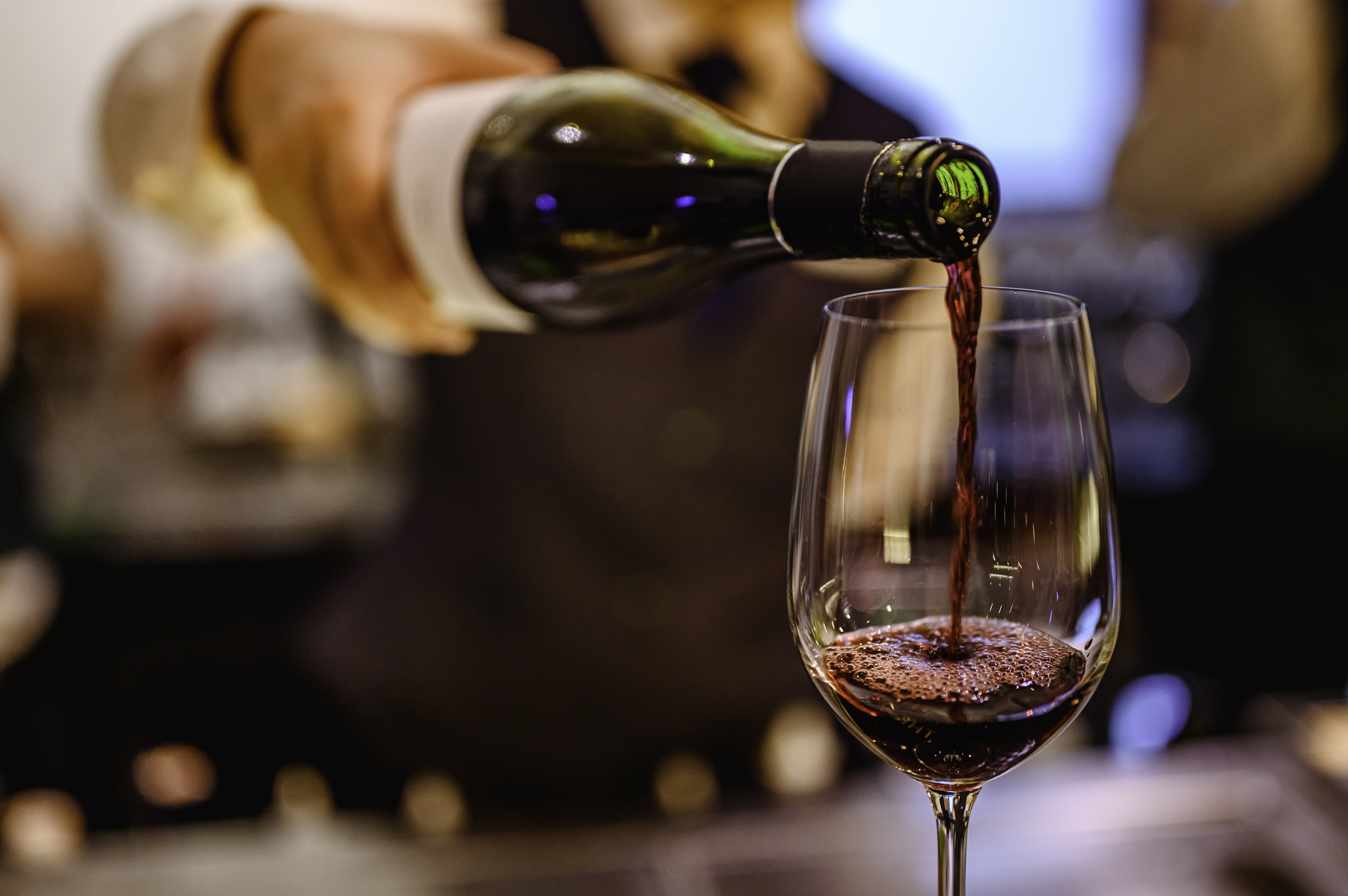 Pouring red wine into glass