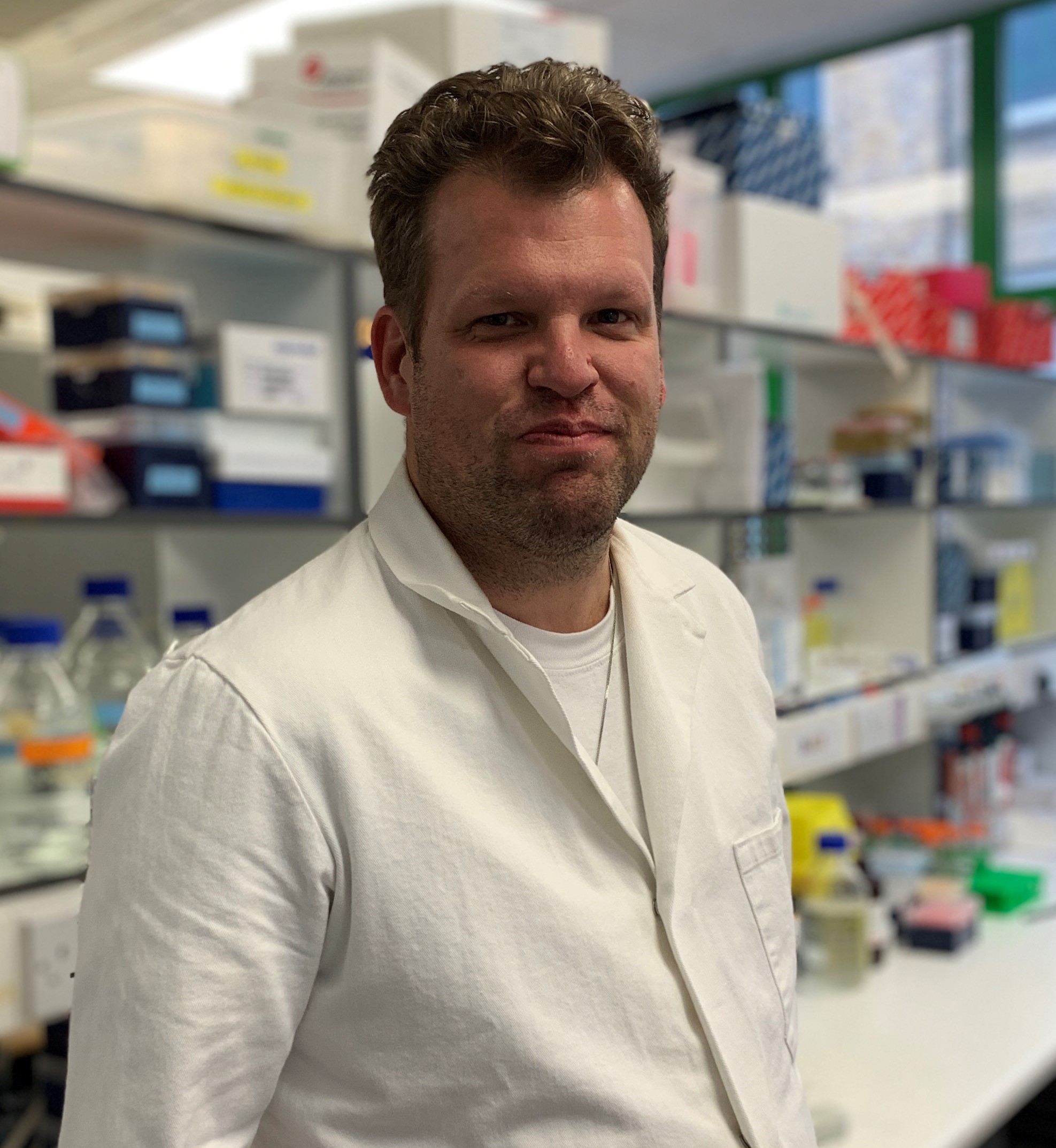 Gavin Arno in white laboratory coat