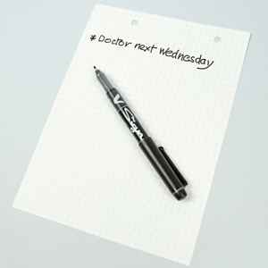 V Sign pen example writing on pad